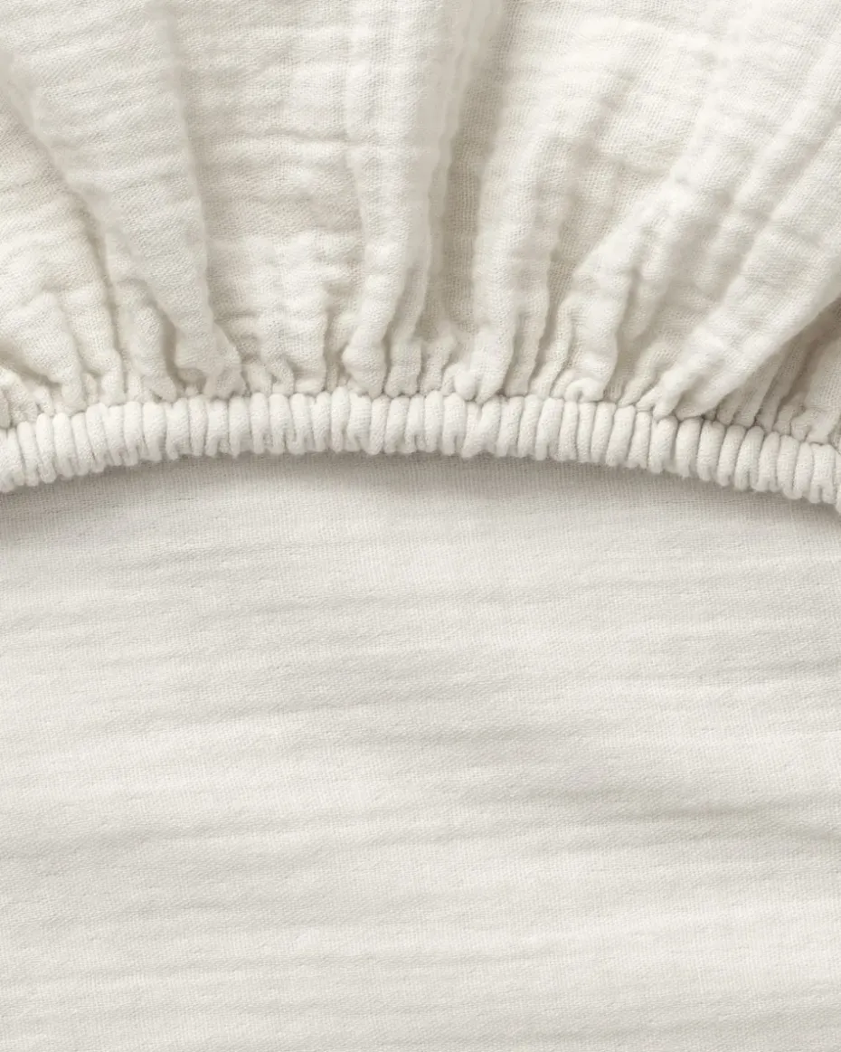 Sábana bajera Eggshell Muslin, 70x140x20 cm
